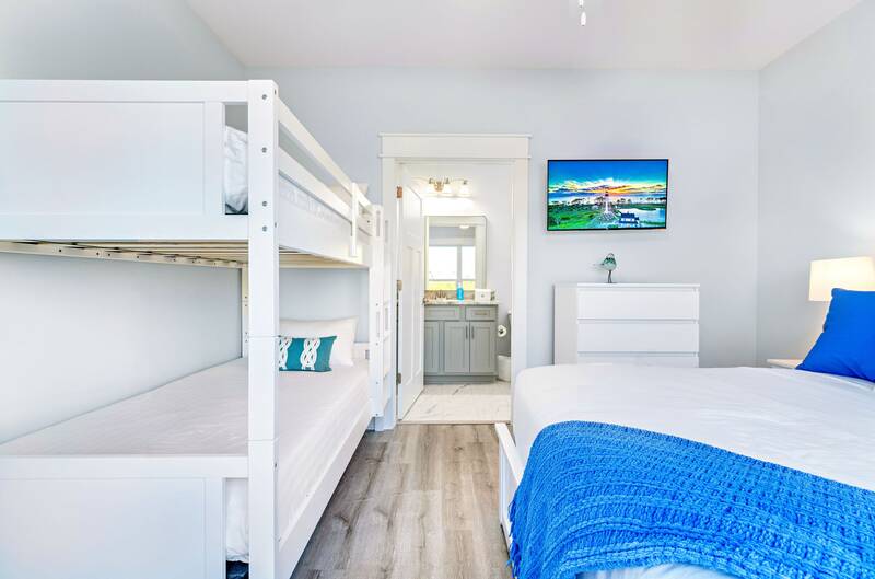 Bunk room with a twin-over-twin bunk and a full bed