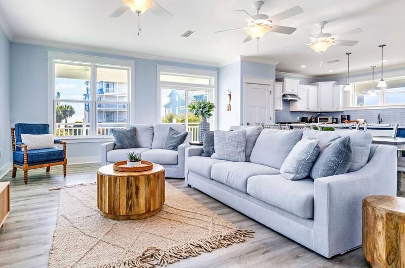 Living room with gray sofas and windows on three sides