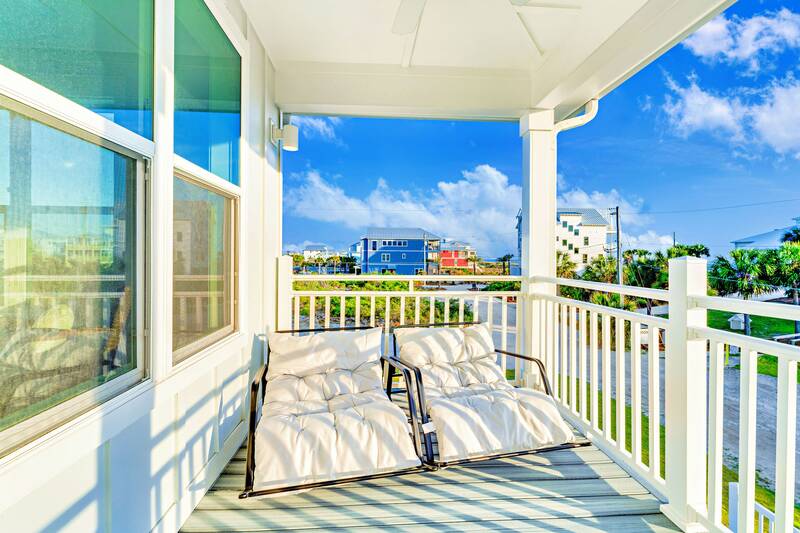 Porch daybed swing facing the water
